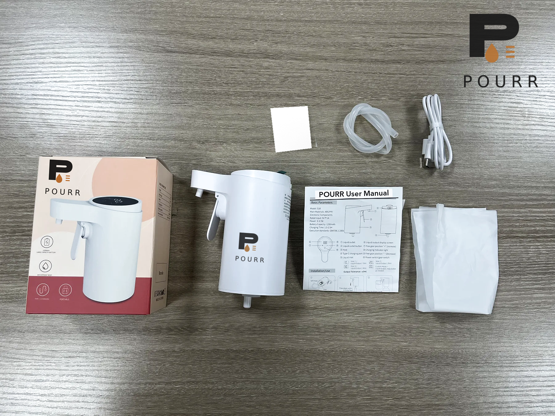 POURR S18 dispenser, box, charging cable, intake hose, manual and storage pouch